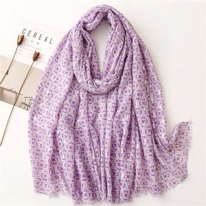 Elegant purple geometric printed scarf with gold foil details and fringe for beach travel