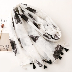 Linen feel scarf with black hand-painted floral print and decorative fringes