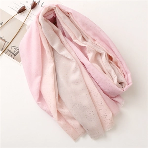 Detailed view of pink gradient shawl with sparkling gold glitter and lightweight texture