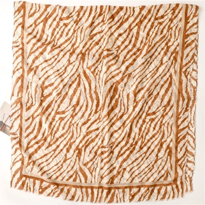 Detailed macro view of zebra pattern on lightweight orange and white chiffon scarf