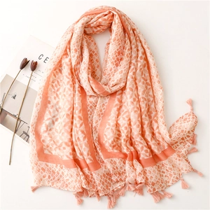 Lightweight pink geometric scarf with tassel fringe for beach sun protection