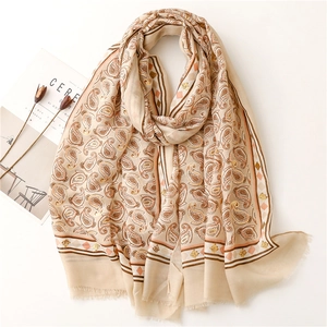 Elegant beige cotton linen paisley scarf with silver foil accents and fringed edges