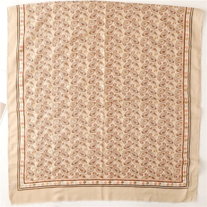 Detail of beige paisley scarf with cotton-linen feel and elegant silver foil printing