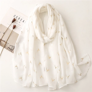Lightweight white scarf with golden deer head foil print and soft texture