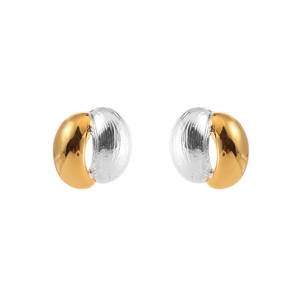 Detail of bicolor gold and silver stud earrings with polished and textured finish