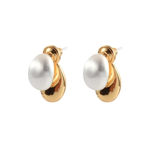 Detailed view of two-tone geometric earrings with matte silver and polished gold finish