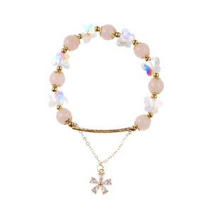 Pink crystal beaded bracelet with iridescent butterfly and zircon flower pendant