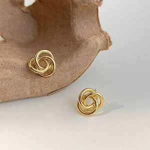 Polished gold plated triple hoop twist earrings with minimalist interlocking design