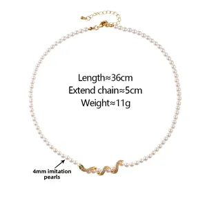 Detailed view of snake pendant with micro-inlaid stones on 4mm pearl necklace