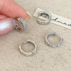 Silver hoop earrings set featuring cubic zirconia pave and textured braided metal designs