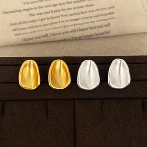 Minimalist oval matte metal stud earrings set in gold and silver finish for women
