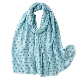 Light blue geometric pattern scarf with gold foil accents on soft cotton-linen fabric