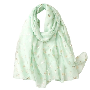 Mint green scarf with gold bird pattern in lightweight semi-transparent fabric
