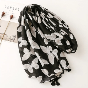 Soft herringbone cotton linen scarf with black butterfly print and fringe details
