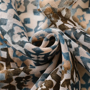 Lightweight gradient geometric scarf in blue and beige with vintage floral tassel details