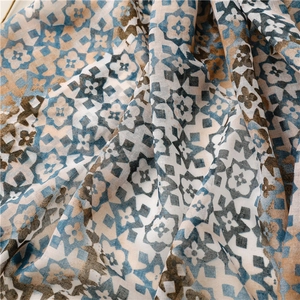 Detailed close-up of geometric floral print on soft breathable bohemian style scarf