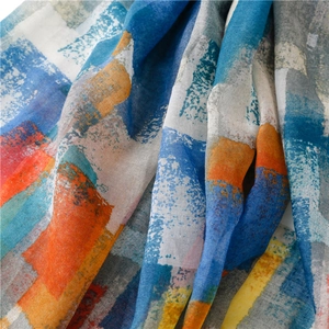 Macro detail of mosaic print cotton linen shawl with colorful geometric oil painting patterns