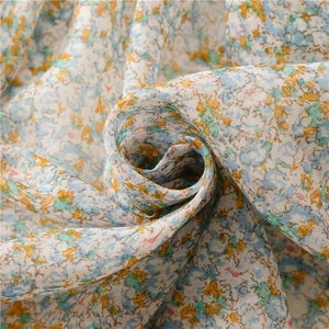 Floral print voile scarf with colorful small flower patterns and soft fringe tassels