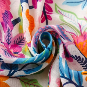 Colorful floral cotton linen beach scarf with fringe and bright herringbone pattern