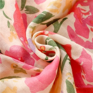 Tropical floral print beach towel shawl with fringe in vibrant pink and yellow