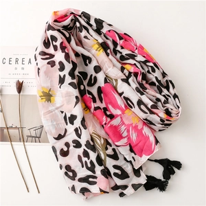 Tropical floral and leopard print scarf with black fringe tassels on white background