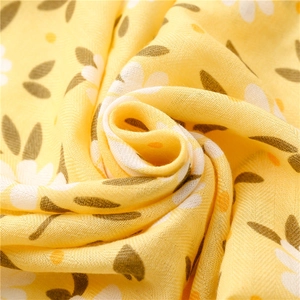 Lemon yellow herringbone cotton scarf with white daisy floral pattern for beach styling