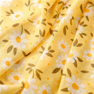 Detailed texture of lemon yellow linen-feel scarf with white daisy floral prints