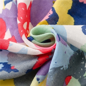 Colorful tropical floral print beach shawl with herringbone texture and tassels