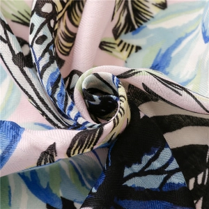 Tropical leaf print cotton linen beach shawl with colorful floral patterns and fringe