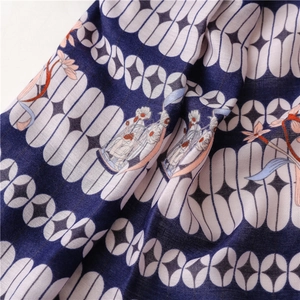 Detail of navy blue geometric pattern and oriental print on soft cotton scarf fabric