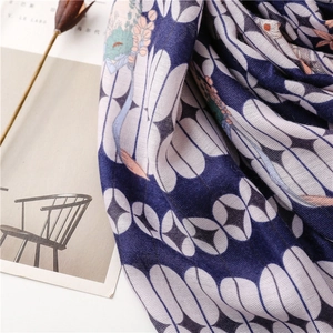 Close-up of navy blue geometric oval patterns on soft cotton-linen blend scarf