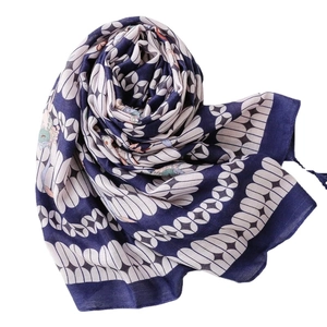 Navy blue geometric petal pattern scarf with elegant tassels on a white background