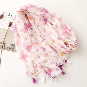 White cotton linen scarf with pink butterfly prints and purple tassels on white background