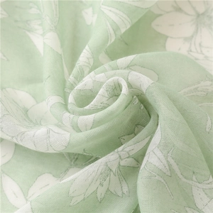 Light green floral cotton linen scarf with soft texture and white flower patterns
