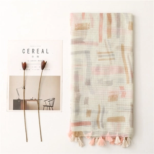 Elegant beige linen-touch scarf with geometric patterns and handmade tassels