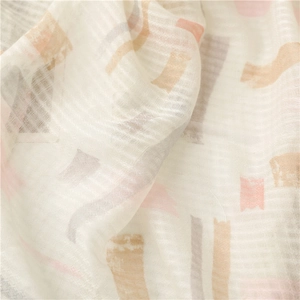 Beige cotton linen scarf with pastel geometric patterns and handmade fringe tassels