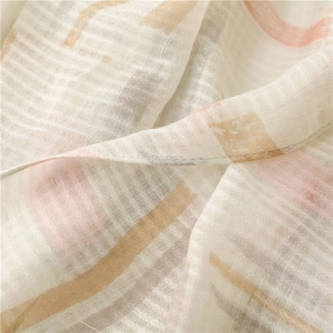 Close-up of lightweight grid weave scarf fabric with pastel art stripes and fine texture