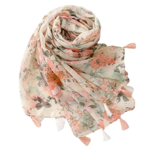 Floral print linen-feel scarf in apricot with orange blossoms and handmade tassels