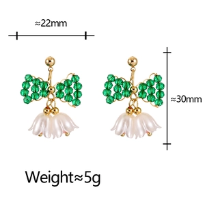 Boucles d'oreilles nœud en cristal vert avec fleurs de muguet blanc et dimensions