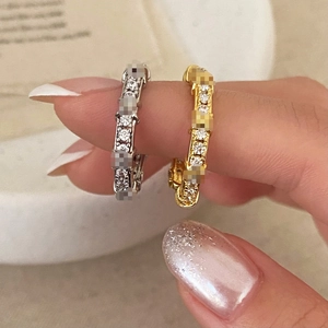 Elegant gold and silver pavé zircon stackable rings worn on hand in high-quality minimalist style