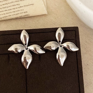 Minimalist silver metal petal stud earrings with a high-polished mirror finish