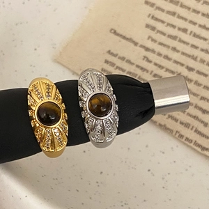 Vintage sunburst tiger eye ring with shimmering zircon accents in gold and silver finishes