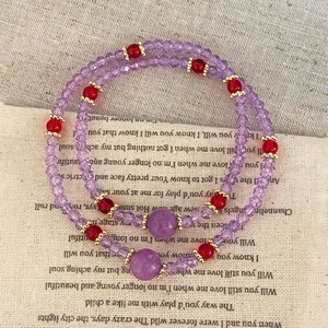 Elegant double-layer amethyst bead bracelet with golden accents and red spacers