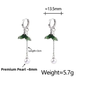 Detail view of green crystal fishtail earrings with pearl drop and dimensions