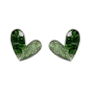 Macro detail of heart-shaped earrings with asymmetrical green crystals and silver finish