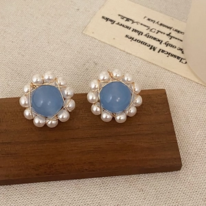 Elegant vintage stud earrings with light blue stone, white pearls and gold wire wrap