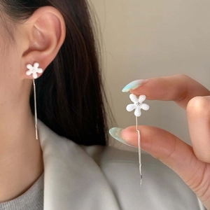 Elegant white ceramic flower tassel earrings with sparkling crystals and silver chain links