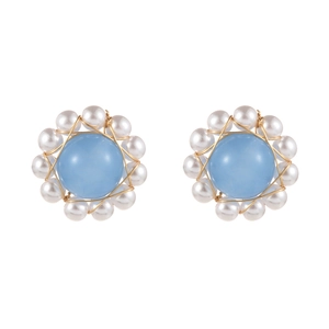 Floral stud earrings with sky blue stone, white pearls, and gold wire wrap details