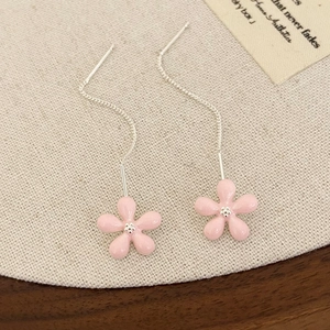 Detailed view of pink flower tassel earrings with oil-dripping petals and silver chain