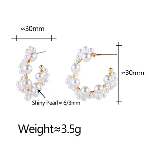Elegant C-shaped pearl hoop earrings with gold wire wrap design for women